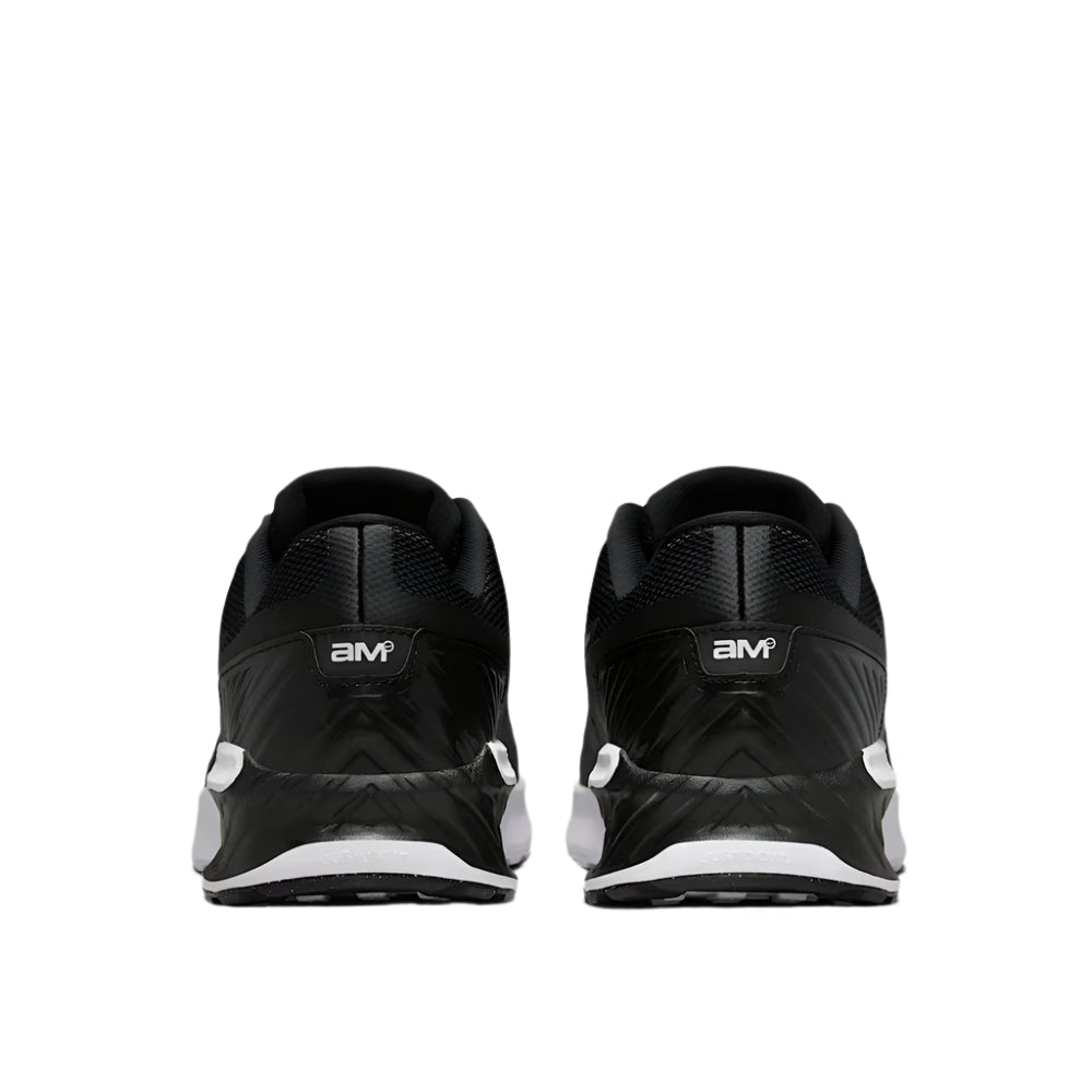 Black athletic shoes with white sole on a light gray background