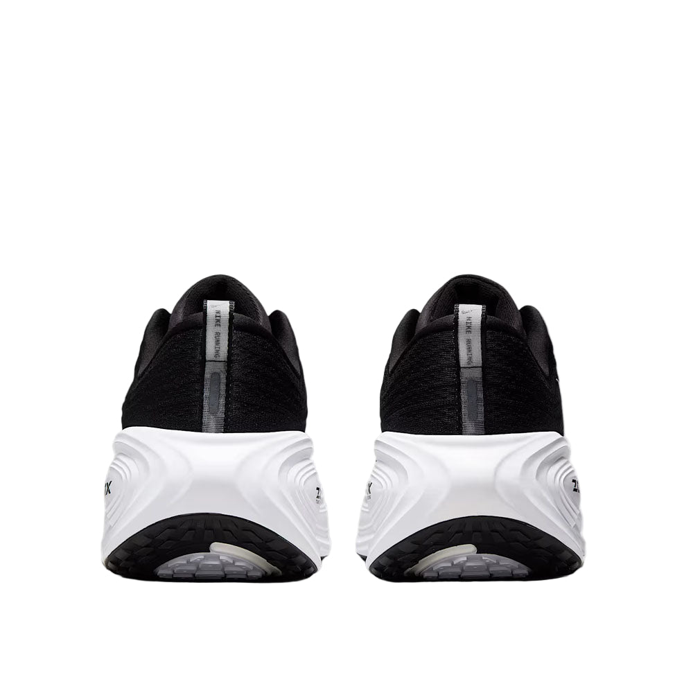 Black and white athletic shoes on a light gray background