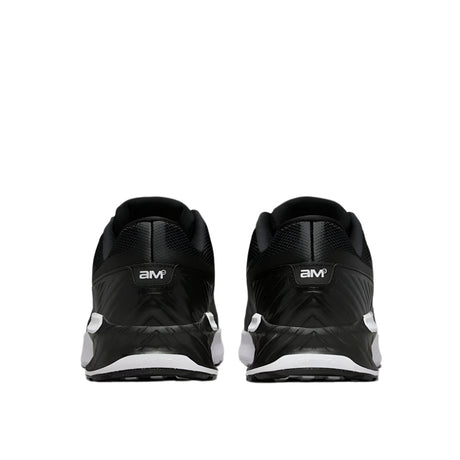 Black athletic shoes with white sole on a light gray background