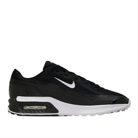 Black sneaker with white accents on a light gray background