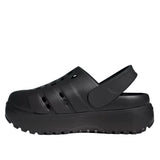 Black clog shoe on a light gray background