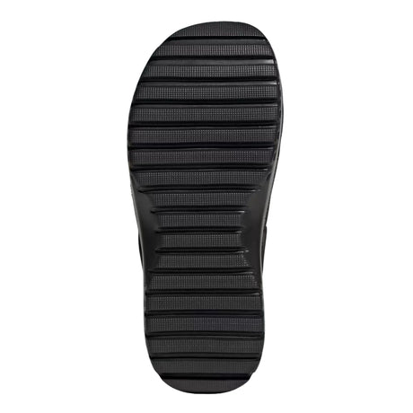 Black sole of a shoe on a light gray background