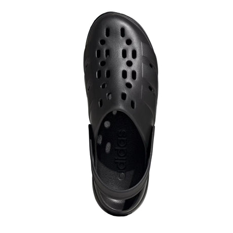 Black sandal with a brand logo on a light gray background