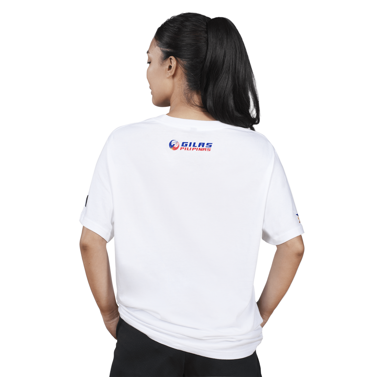 Person wearing a white t-shirt with a logo on the back against a white background