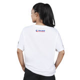 Person wearing a white t-shirt with a logo on the back against a white background