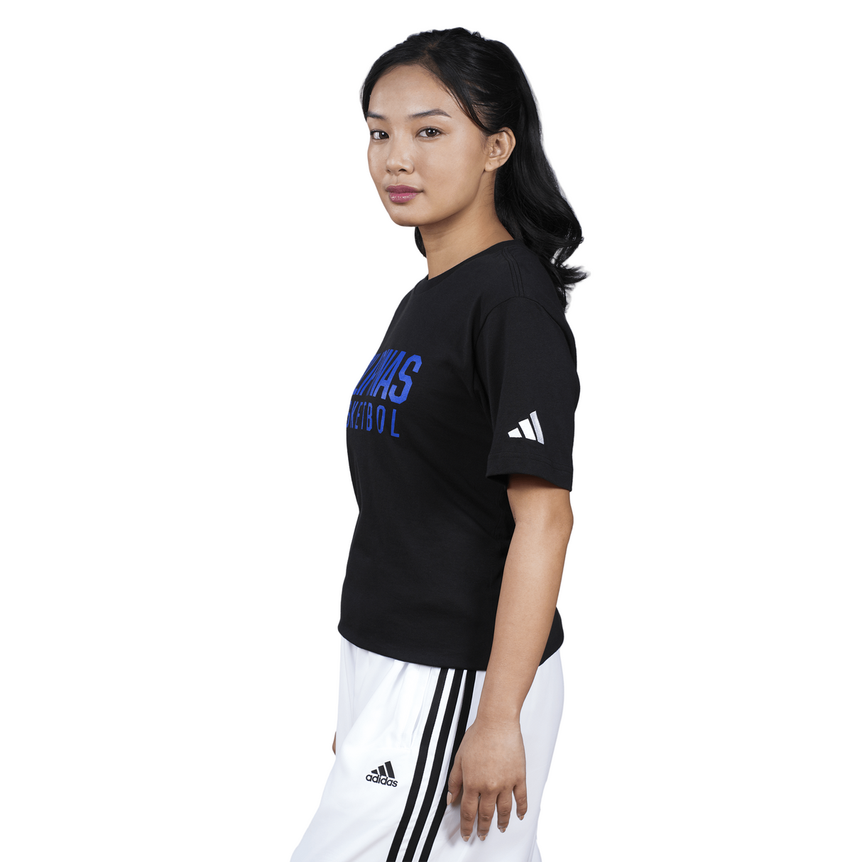 Person wearing a black Adidas t-shirt with blue text on a white background